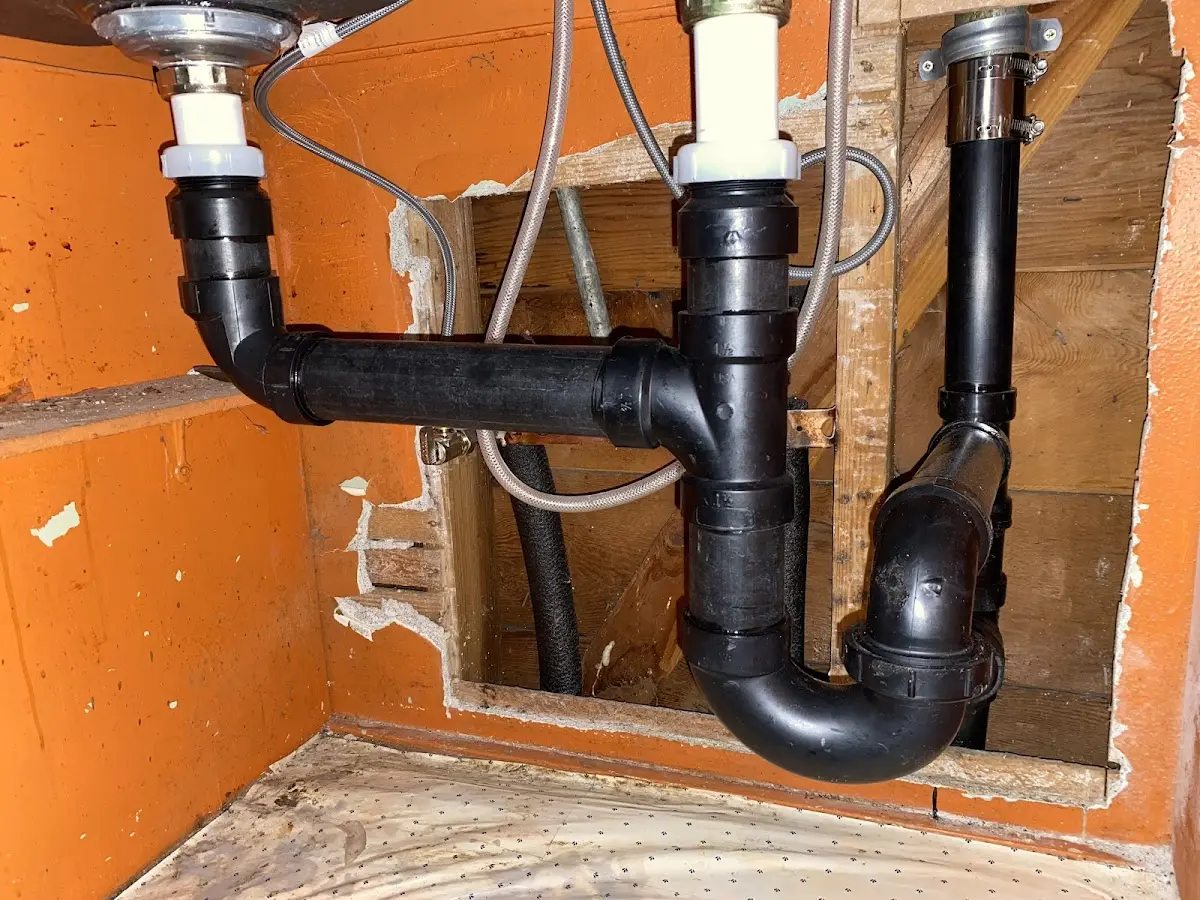 Professional Garbage Disposal Repair equipment and tools on the job in Centreville
